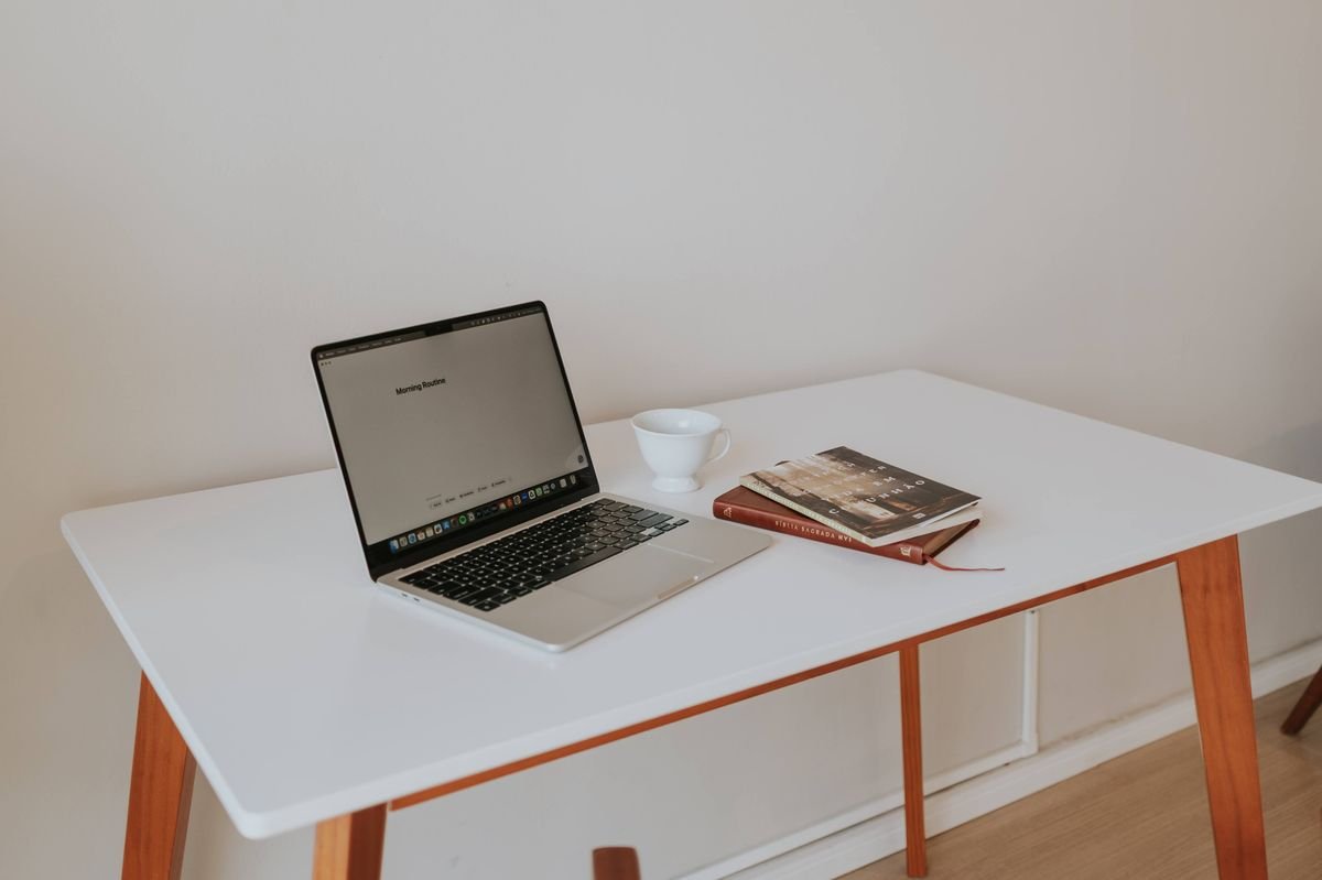 Laptop on desk: 'Connected systems for growing businesses.'
